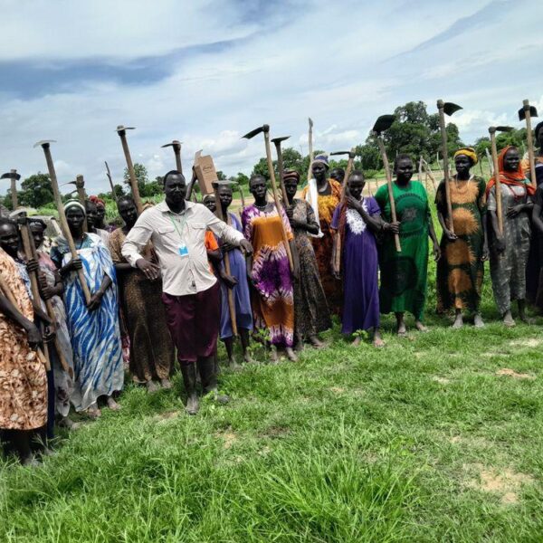 A women’s farming group assembles for work