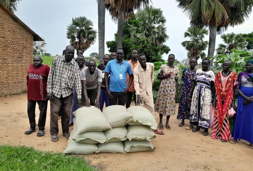 Harvest bags handed to a producer group