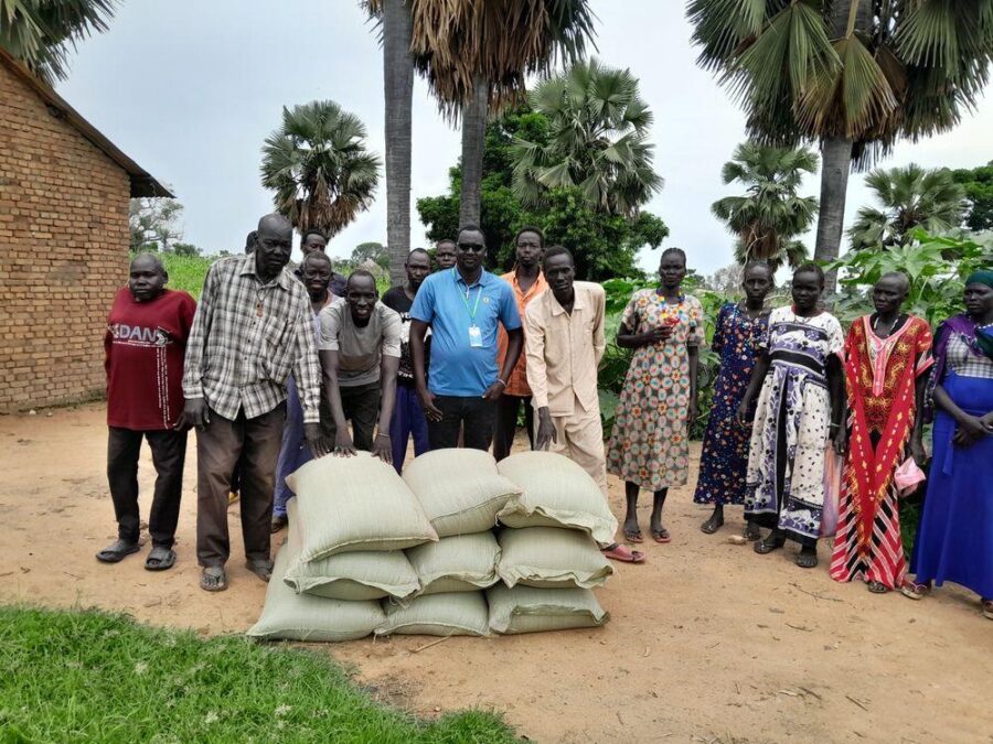 Harvest bags handed to a producer group