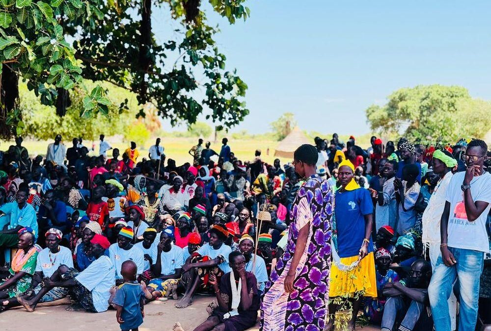 Addressing the community at a public meeting